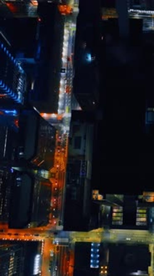 Flying slowly above the modern city at night. Highlighted streets of Philadelphia, Pennsylvania, USA