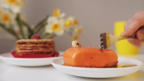 Delicious Dessert Cake Being Cut with a Fork