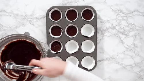 Flat Lay Baking Chocolate Cupcakes Scooping Chocolate Cupcake Batter Into a Cupcake Pan