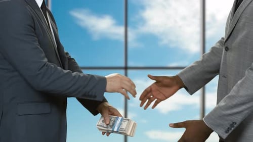 Men with Cash Shaking Hands