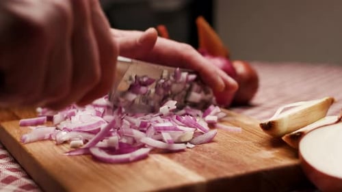 Dicing Red Onion on a Wooden Cutting Board