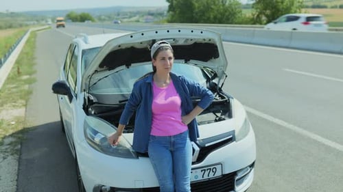 Woman with Car Trouble on Rural Road