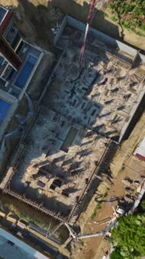Vertical Video HighQuality Construction Captures Workers and Engineers Shaping Rebar and Pouring