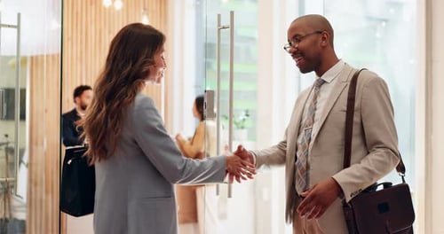 Meeting, introduction and business people with handshake in office for agreement, deal or contract