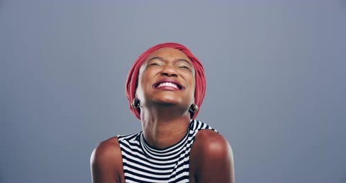 Woman Smiling and Giving Thumbs Up