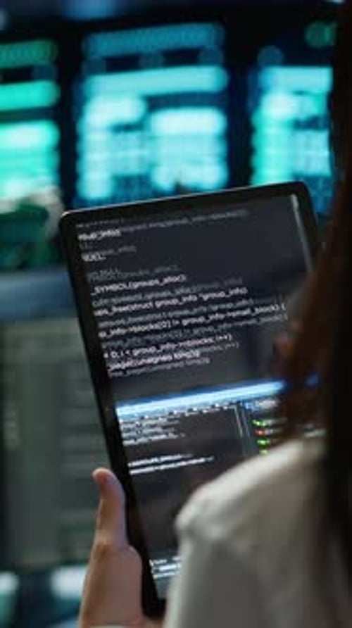Vertical Video Close Up of Woman Doing Maintenance in Server Room Using Tablet