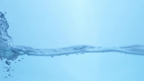 Fluid Motion in Nature. View of Blue Water Waves Creating Smooth Ripples.