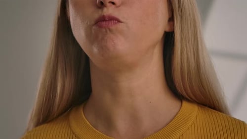 Woman Eating Potato Chips in Close Up