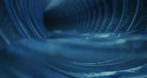Slow motion of pipe tube inside view of water cleaning process of domestic and industrial waste se