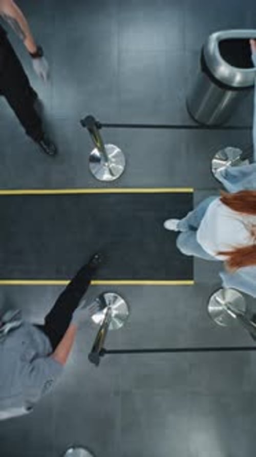 Aerial View of People at Airport Security Checkpoint