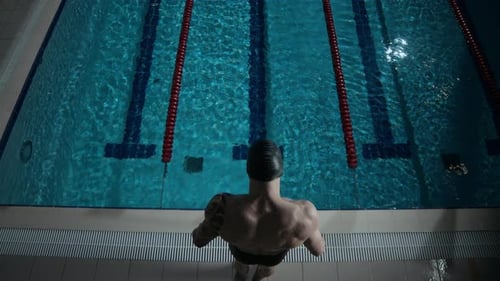 Man Jumping into Pool Water