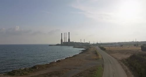 Aerial View of Electricity Production By a Factory on the Seashore