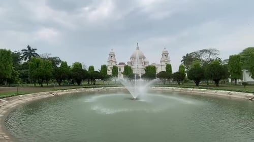 Pan shot of Victoria Memorial Kolkata with beautiful fountains.