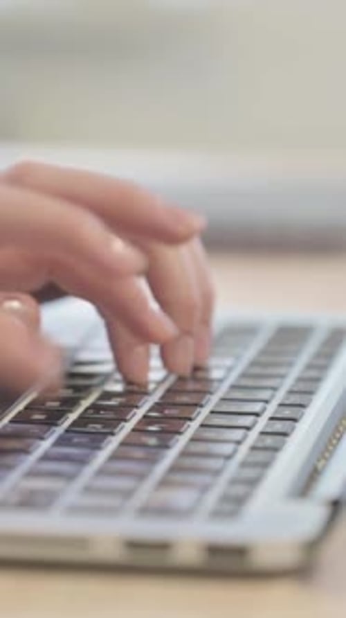 Side View of Woman Typing on Laptop, Close up, Vertical Video