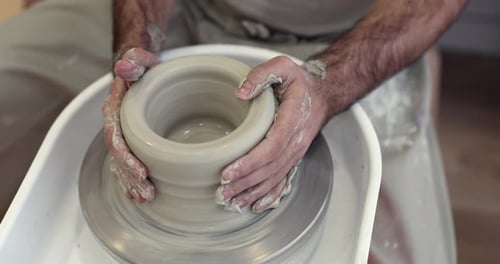 Potter Shaping Clay on Wheel, Craftsmanship and Art