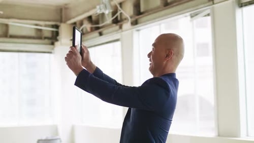 Man Taking Photo in Empty Office Space Adult