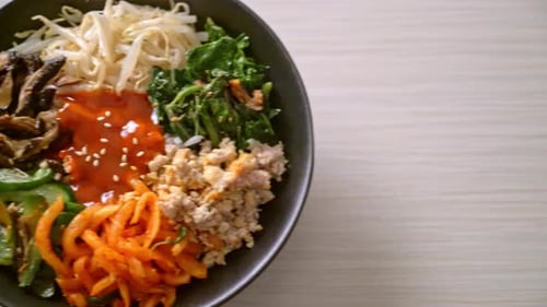 Vibrant Bibimbap Bowl with Vegetables and Rice