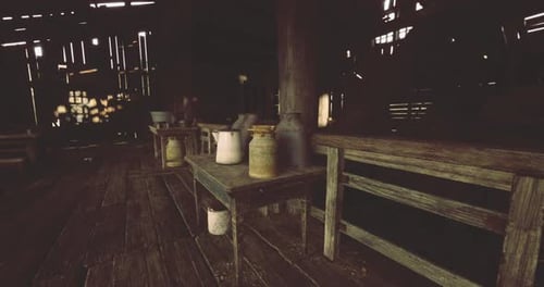Rustic Barn Interior with Old Farm Equipment Panning Shot