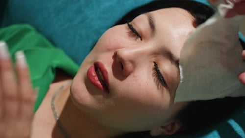 Woman Receives Facial Massage at Home Spa Treatment