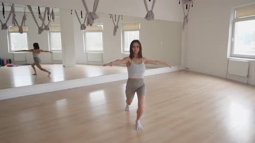 An Elegant and Graceful Dance Practice Taking Place in a Studio Setting with Passion