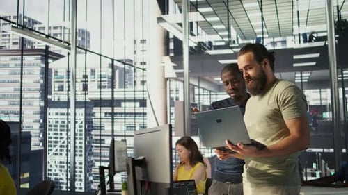 IT Staff Members in Office Analyzing and Interpreting Complex Data