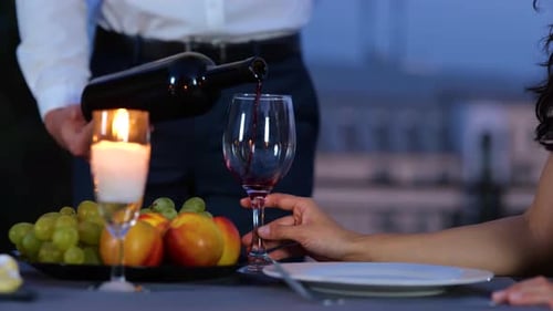Romantic Couple Enjoying Wine at Elegant Date Night