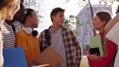 Group of Cheerful Students Laughing Together Outdoors