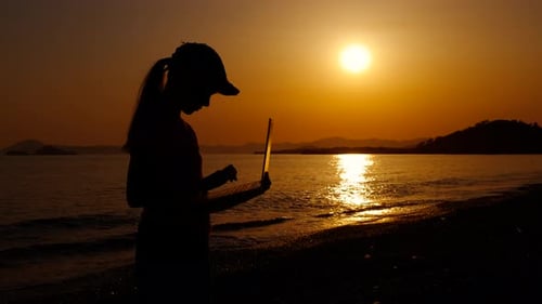 Traveler Uses Laptop on Sea Weekend