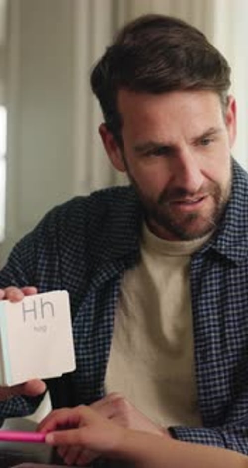 Learning, child and dad with flash cards in home for animal questions, alphabet knowledge or study