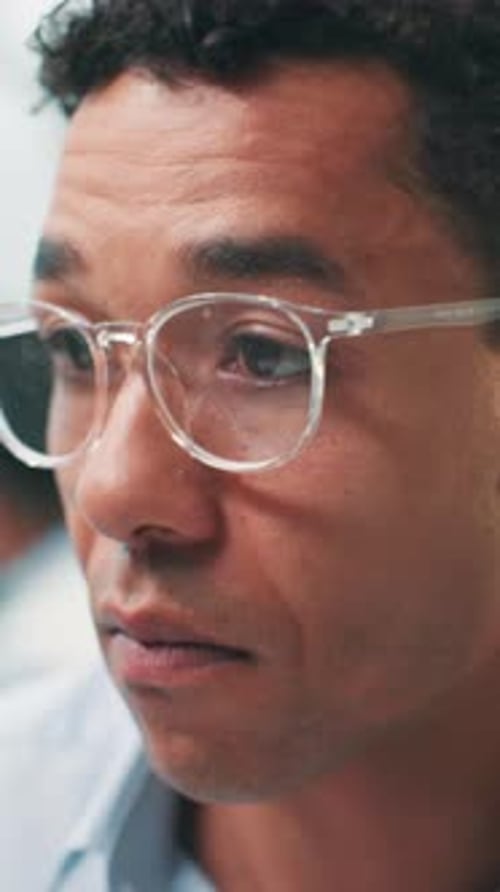 Man, software developer and programming with glasses for problem solving, web or design at office