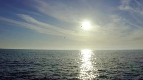 Scenic Ocean View with Sun and Blue Sky