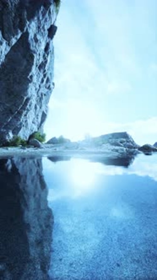 Rocky Cliff Surrounding Body of Water