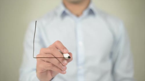 Man Drawing Growing Sales Line Graph