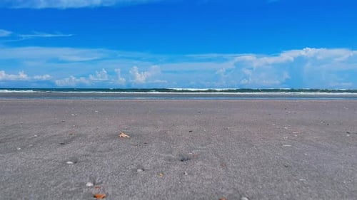 Calm Waves Gently Meeting Sandy Beach