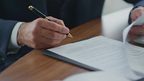 Unrecognizable Businessman Signing Official Documents by Pen Close Up. Man Hands Putting