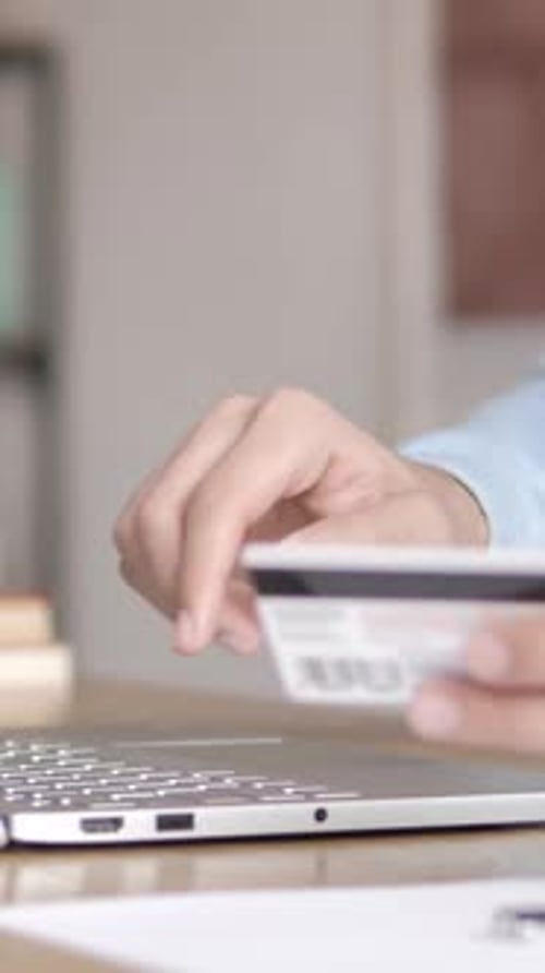 Hands Type on Laptop with Credit Card