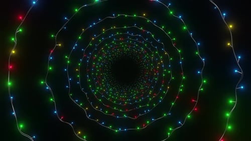 Spiral tunnel of colorful Christmas lights on a black background, featuring glowing red, green