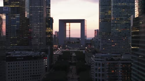 Futuristic Cityscape with Grande Arche at Sunrise