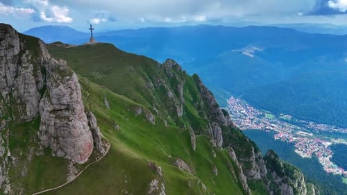 Distancing from the Caraiman Peak with a Cross memorial.