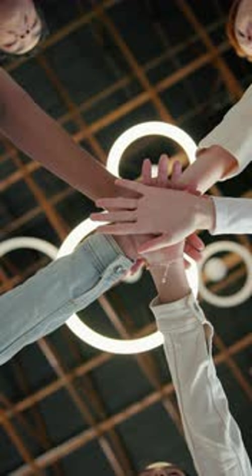 People, team and unity with hands together in circle for synergy, trust or mission below