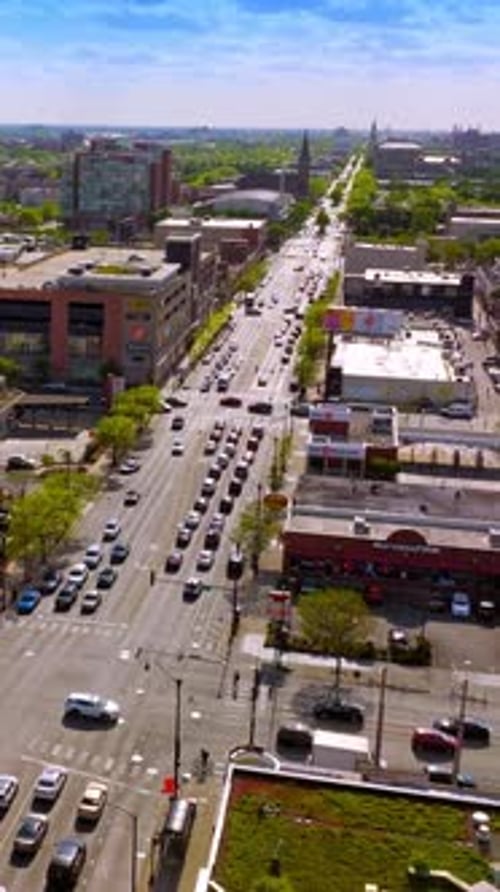 Busy roads and parking lots of Chicago, Illinois. Aerial perspective on the sunny city at daytime.