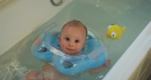 Infant Bathing with Inflatable Collar and Toy