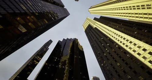 Tall Buildings Reaching for the Sky in a Bustling Urban Environment