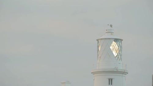Close up view of lighthouse on cloudy evening. Strumble Head Lighthouse.