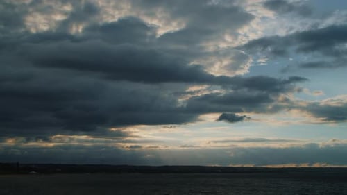 Dramatic Time Lapse Sunset Over Clouds