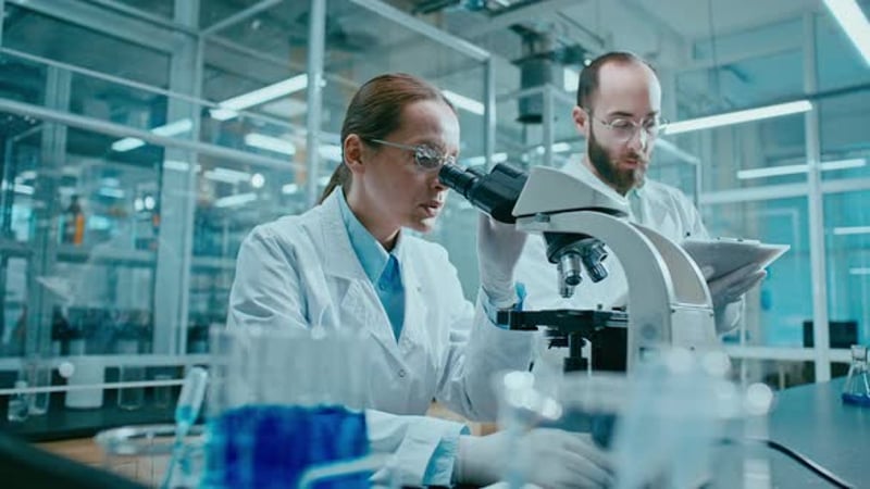 Scientists Working With Microscope in Laboratory, Science Stock Footage ...