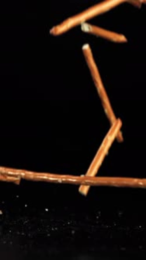 Salted Cracker Sticks Fall on the Table Filmed on a Highspeed Camera at 1000 Fps
