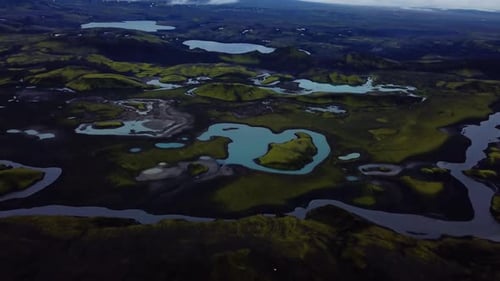 Aerial landscape view of Icelandic highlands textures, dark hills and mountains, rivers and lakes, o