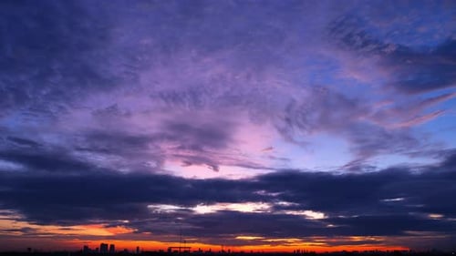 Colorful Sunrise Time Lapse over City Skyline
