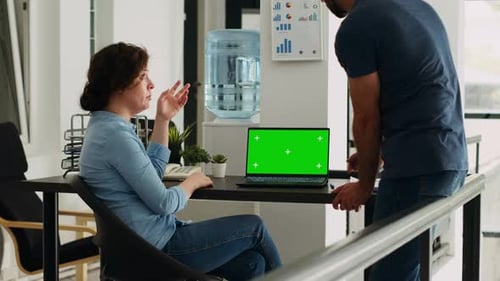 Colleagues Discussing Business with Chroma Key Laptop